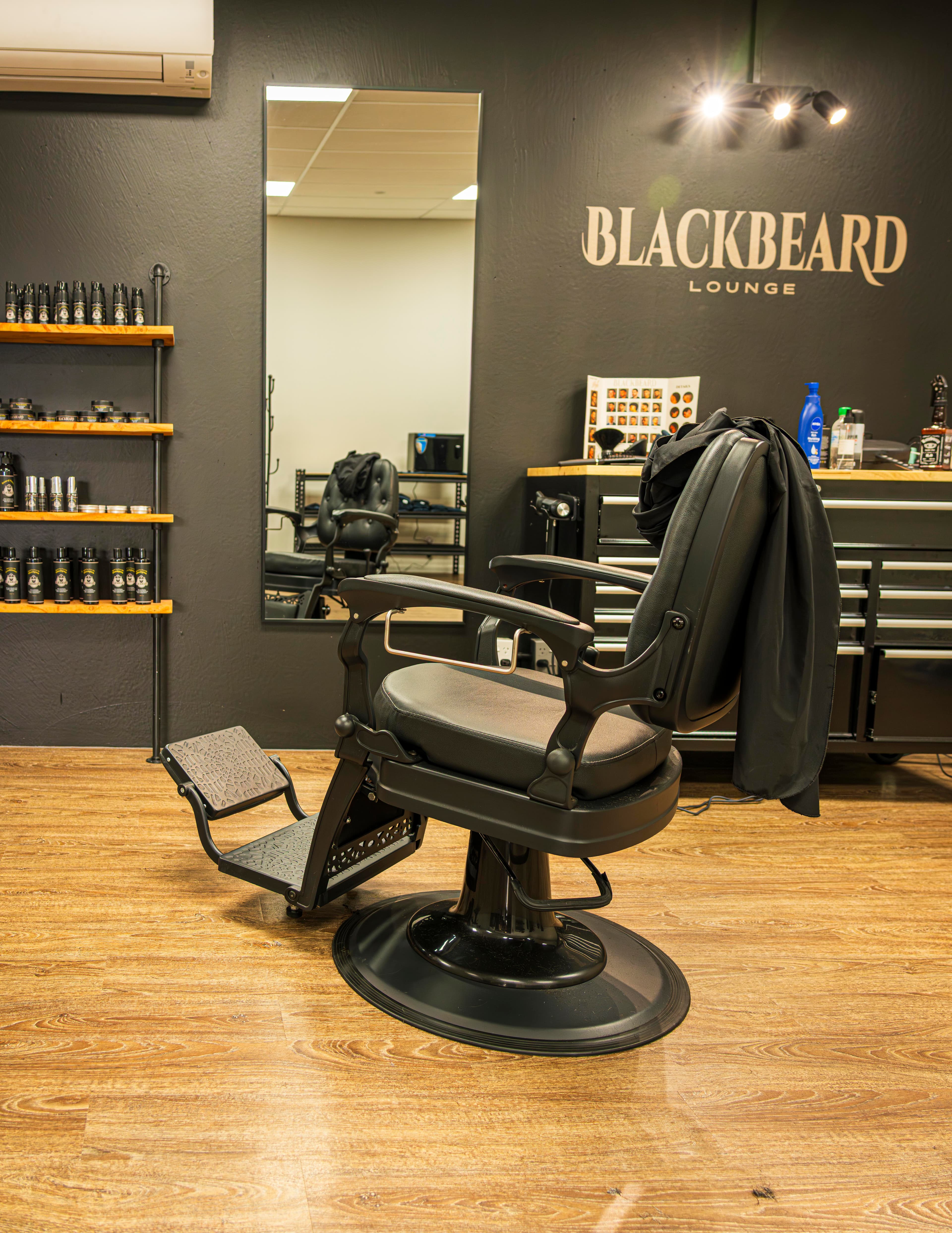 A barber chair ready for customers at Blackbeard Lounge